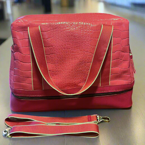 Voyager Travel Bag in crocodile embossed and Italian pebbled leather with antique bronze hardware, showing dual compartment design