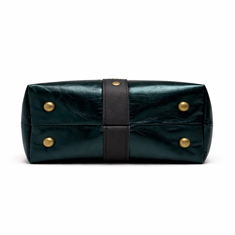 Bottom of lambskin crossbody showing 4 protective purse feet