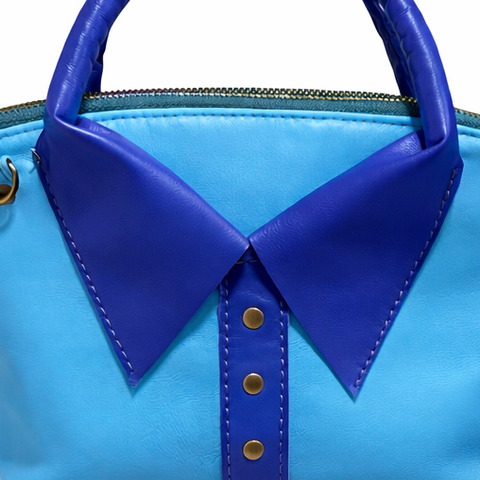 Close up of Blue handbag with a collar design on a white background