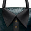 Close up of rolled leather handles and brass stud collar detail on lambskin bag