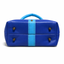 Bottom of royal blue crossbody bag showing 4 brass purse feet and sky blue center stripe