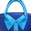 Close up of a royal Blue handbag with a sky blue collar and button detail on a white background