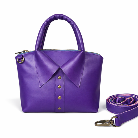 Handmade royal purple leather collar bag with rolled top handle, antique brass studs, and detachable adjustable crossbody strap