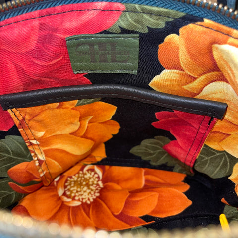 interior cotton lining with a slip pocket and Inspired Leather Co label